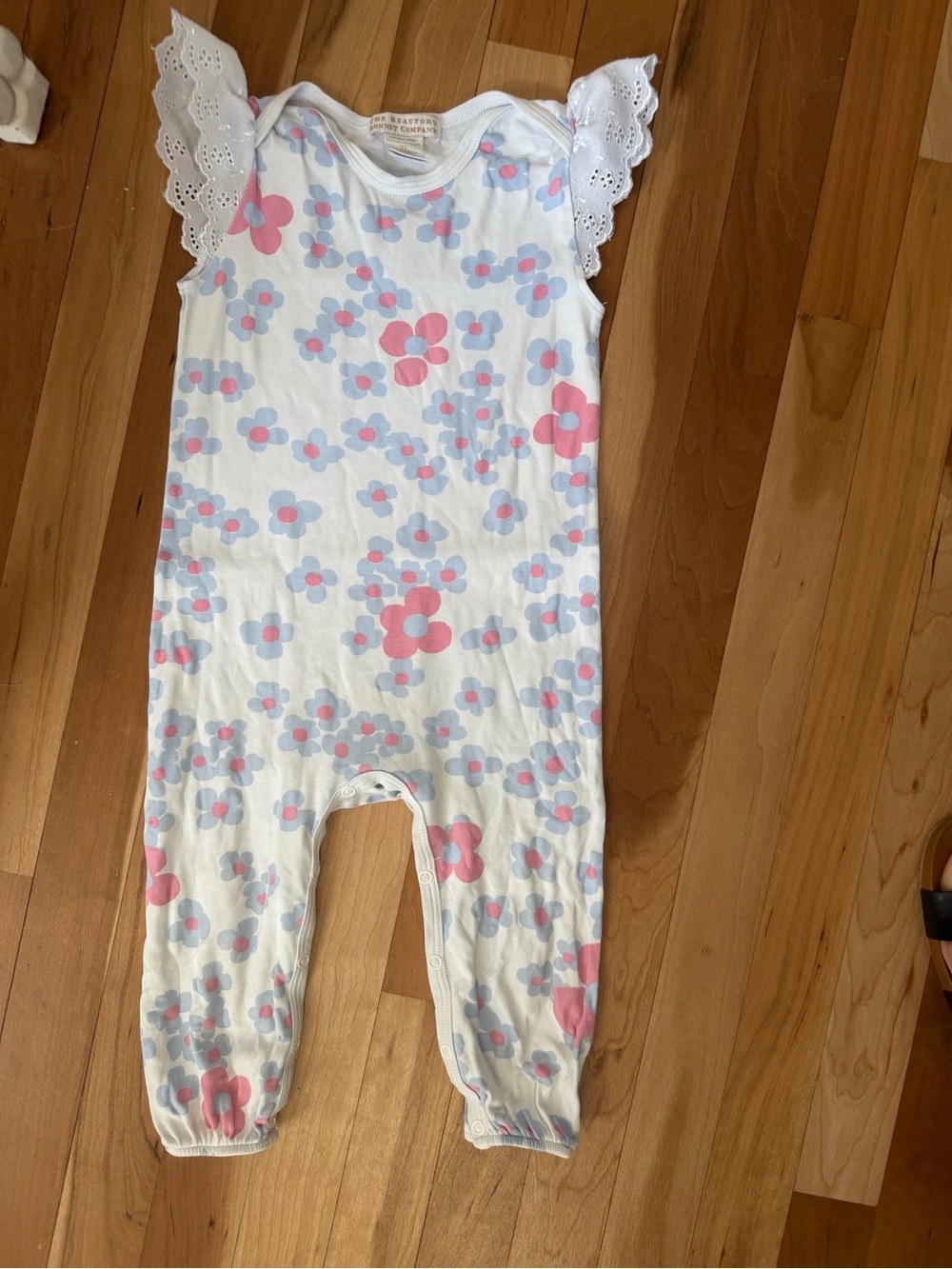 White Floral Sleeveless Baby Romper with Eyelet Shoulders